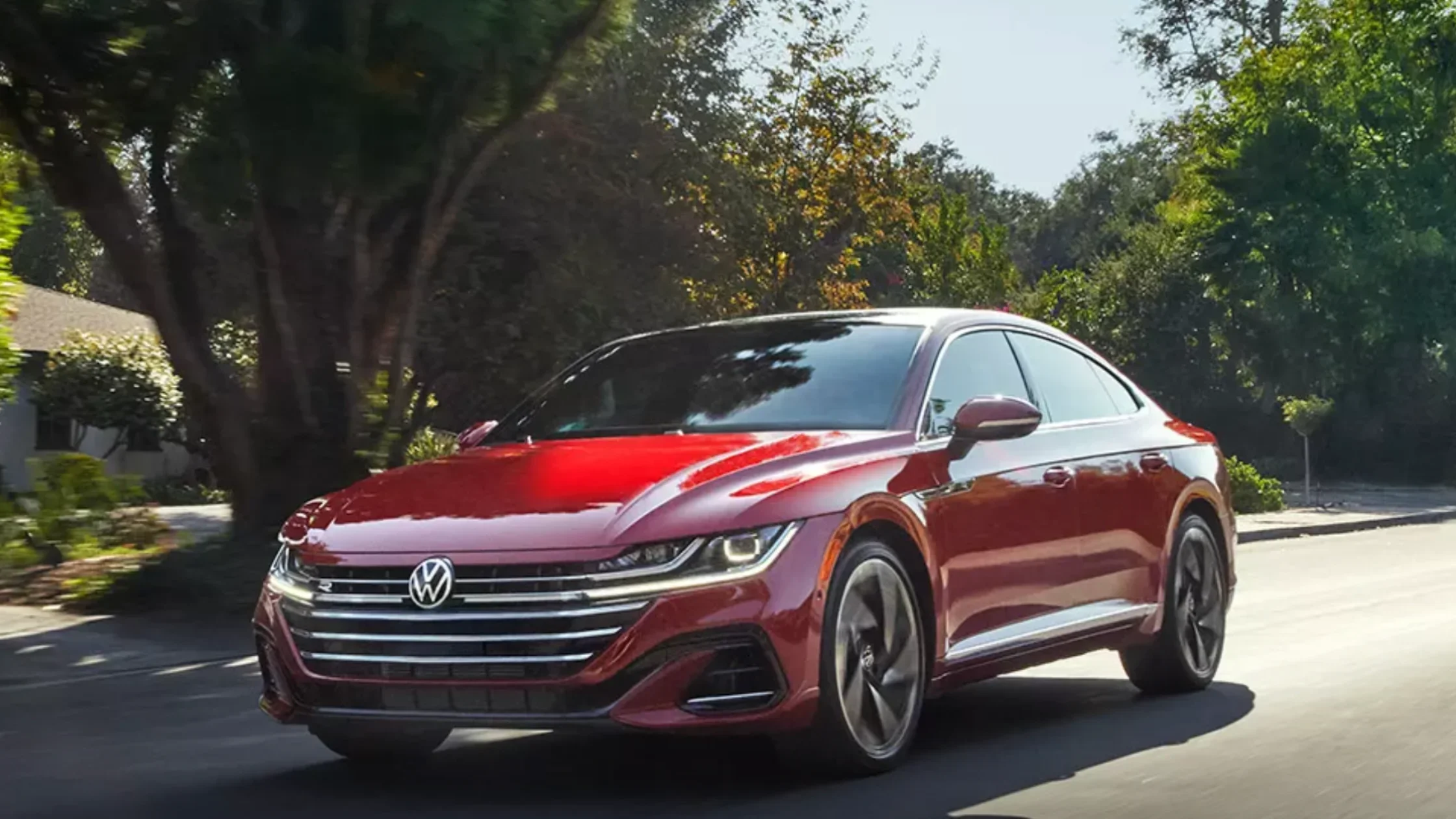 A 2020 Volkswagen Arteon driving along a scenic road near Charlotte, NC