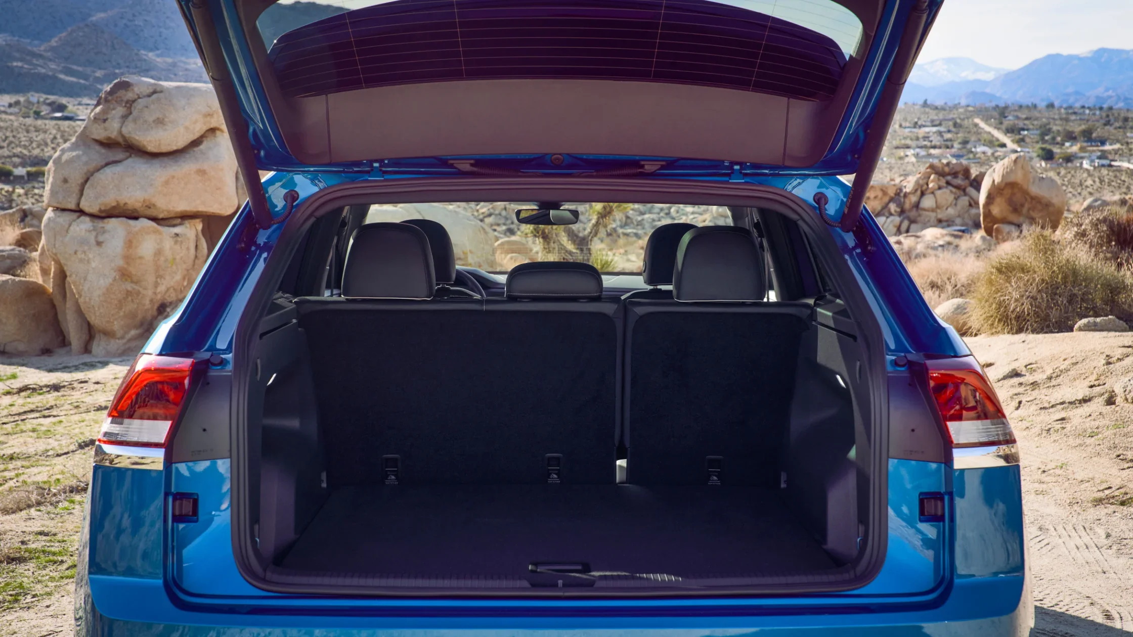 2024 Volkswagen Atlas Cross Sport open trunk showcasing spacious cargo area.