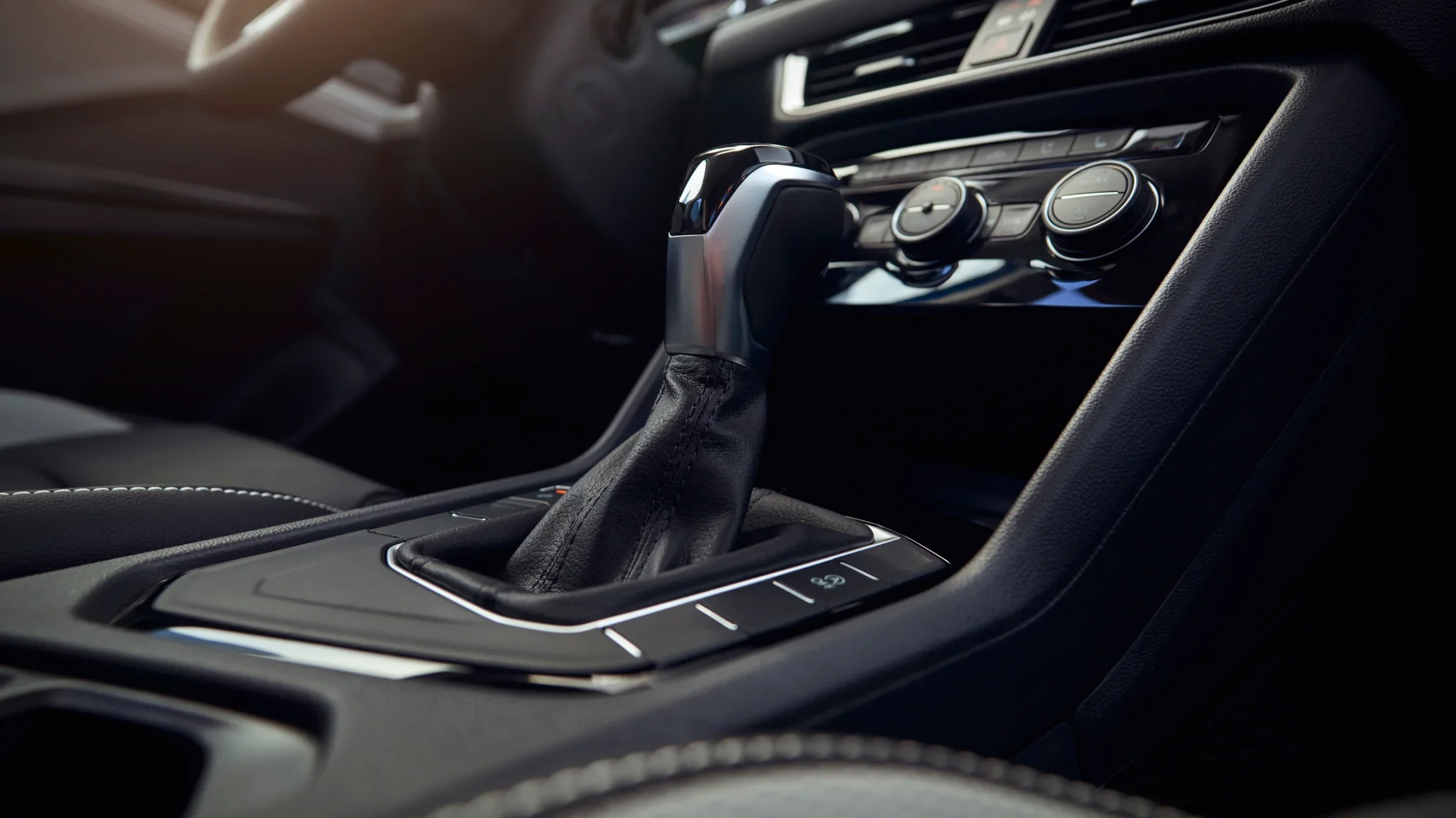2024 Volkswagen Taos gear shift close-up with sleek interior detailing.