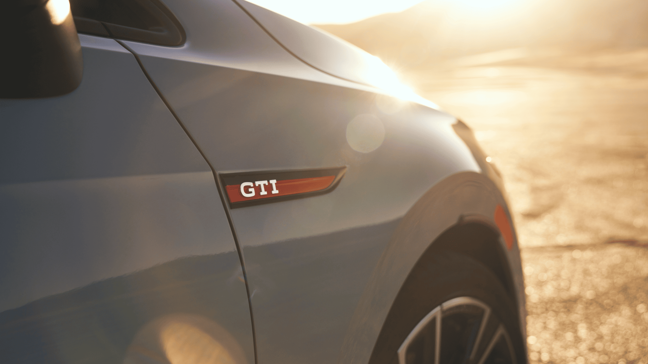 2024 Volkswagen Golf GTI Side View In the Sunset