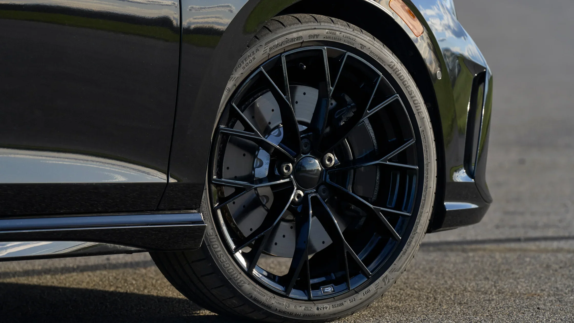 Close-up of black alloy wheel and performance brakes on 2025 Volkswagen Golf R