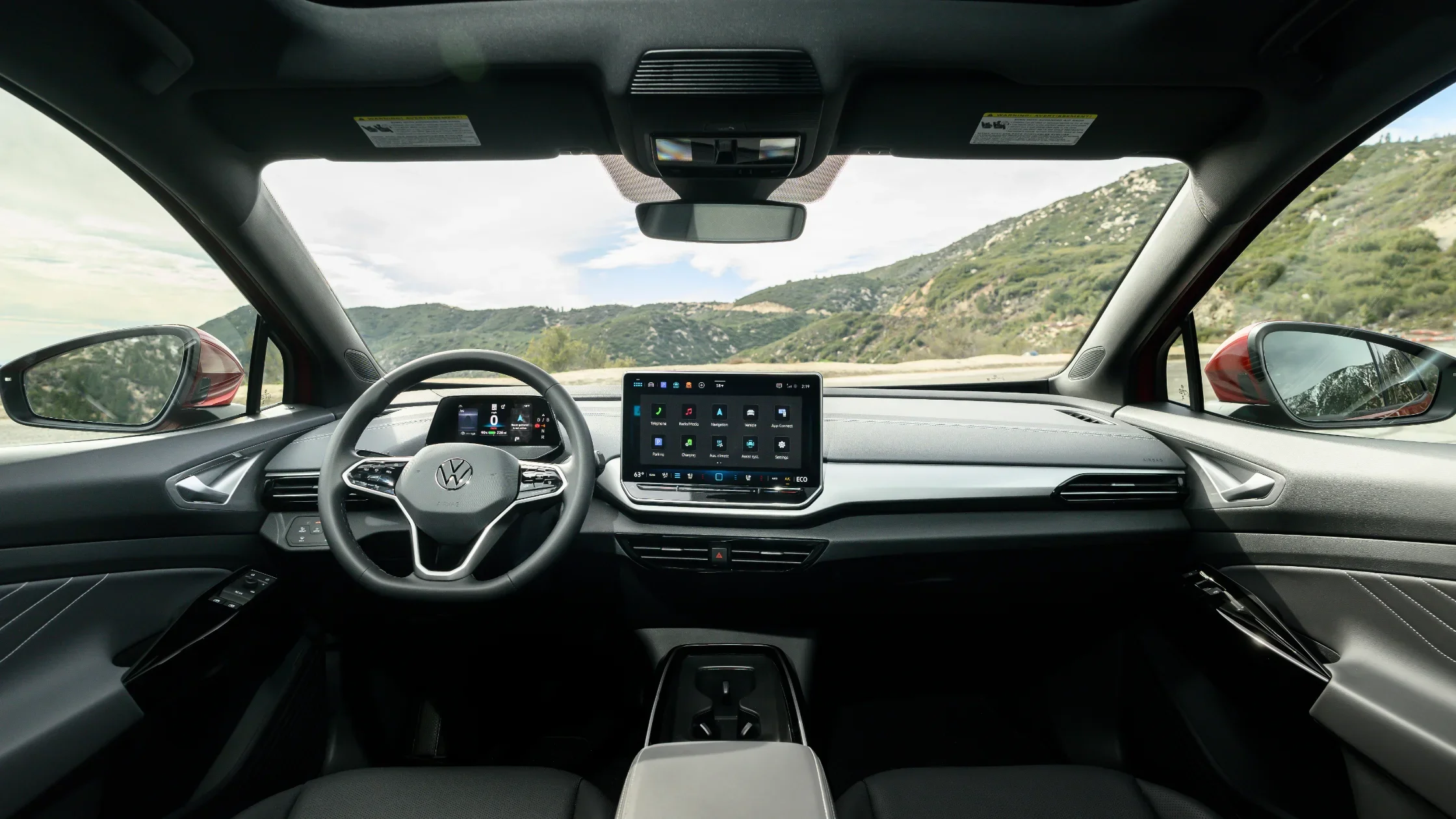 2025 Volkswagen ID.4 interior dashboard featuring digital cockpit and central touchscreen.