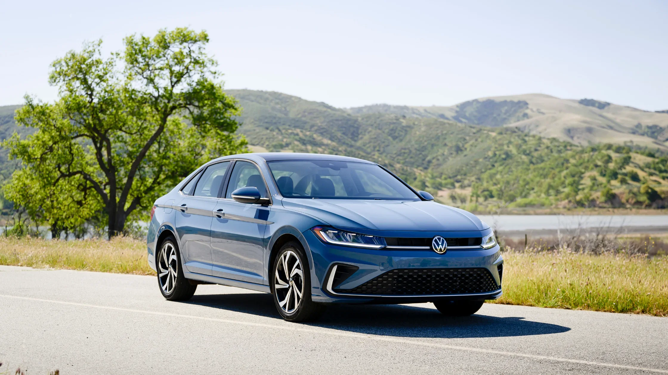 Front exterior view of the 2026 Volkswagen Jetta sedan with bold grille and LED headlights.