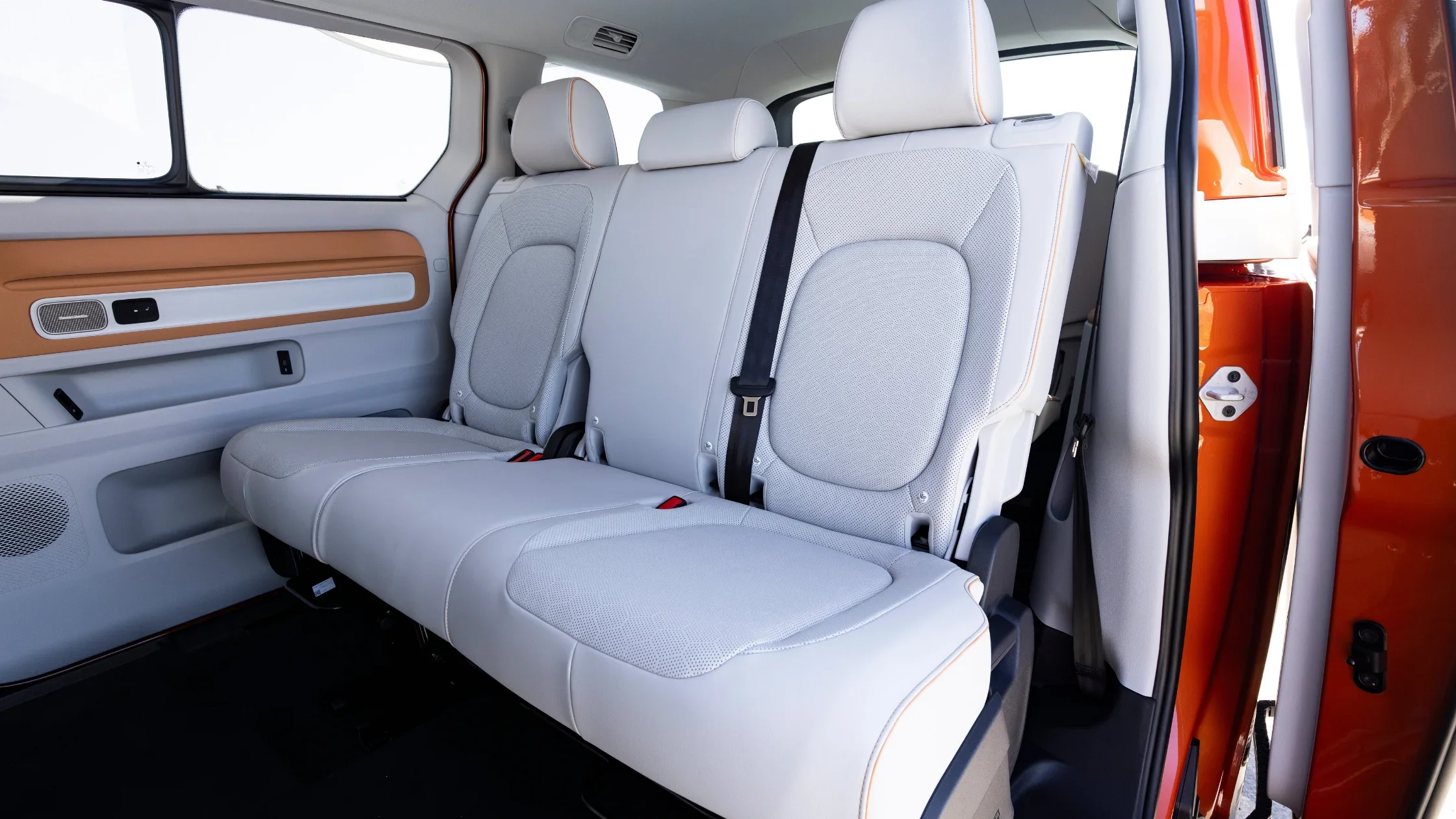 2025 Volkswagen ID. Buzz rear seat interior with light upholstery and spacious cabin.