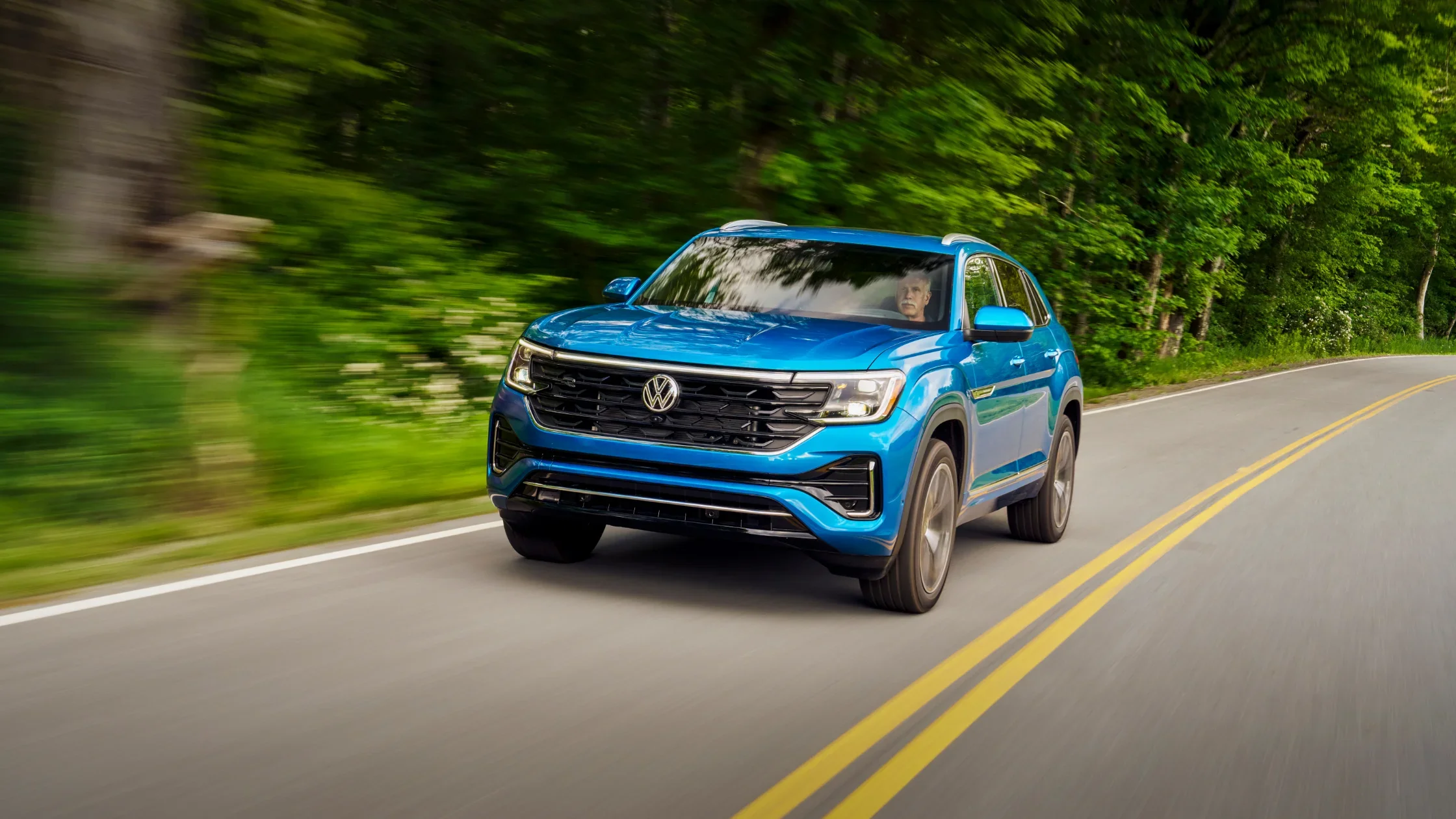 Close-up of the 2025 Volkswagen Atlas Cross Sport gear selector and engine start/stop button.
