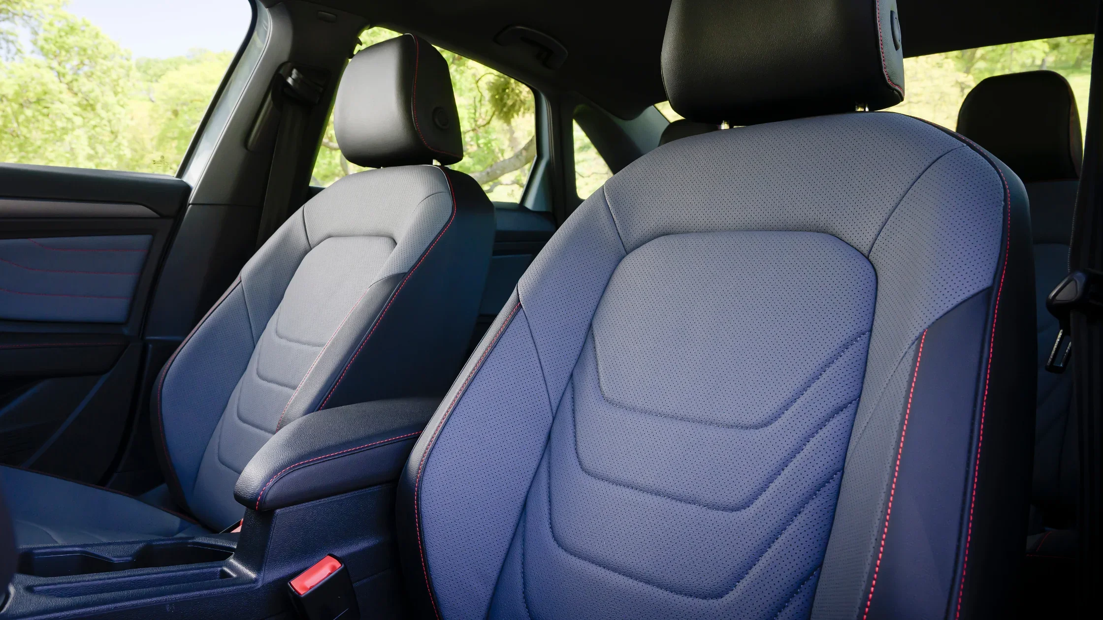2026 Volkswagen Jetta GLI interior sport seats with perforated leather and red stitching.