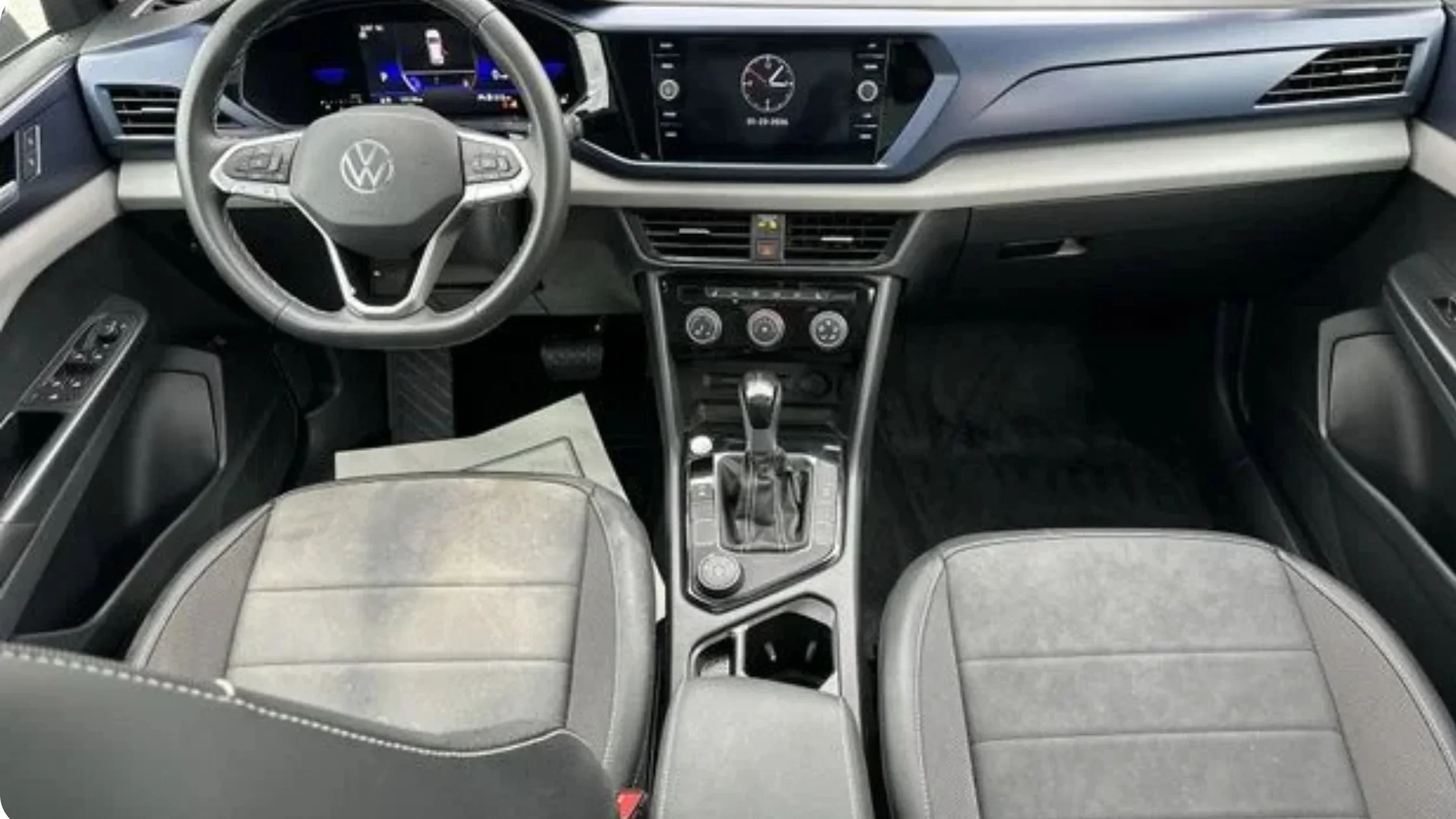 Certified Pre-Owned Volkswagen Taos interior dashboard with digital instrument cluster and center infotainment display.
