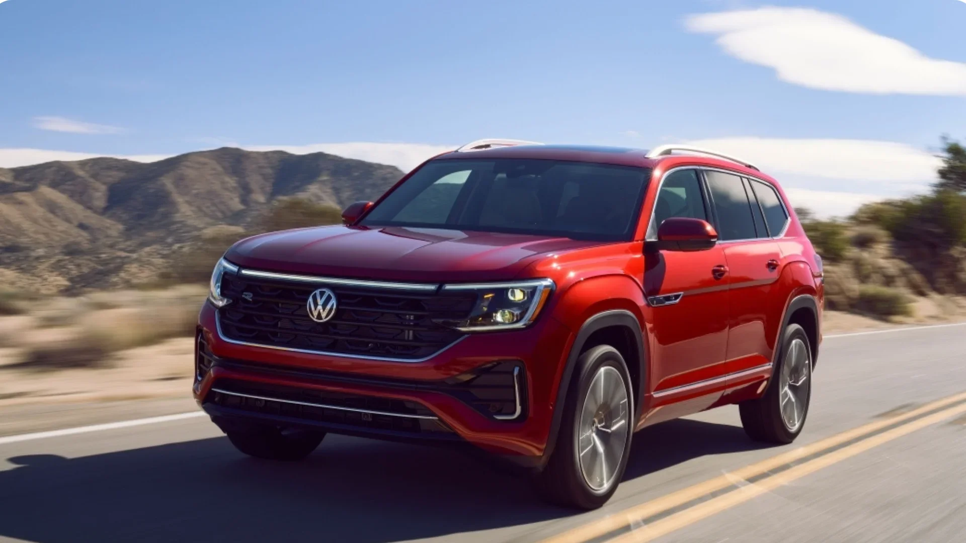 Front interior view of the 2026 Volkswagen Atlas with mountain background.