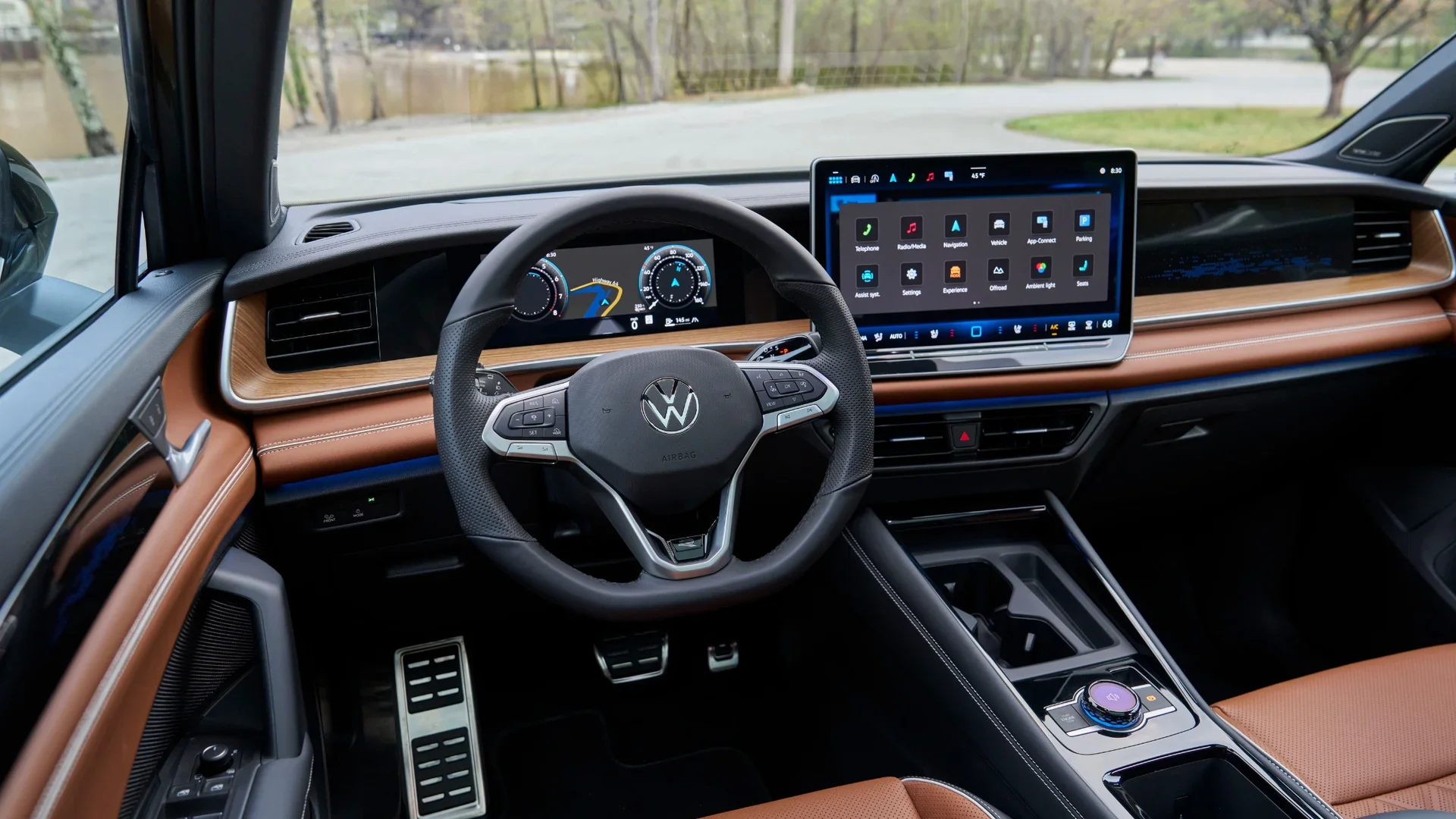 Interior of 2026 Volkswagen Tiguan SEL R-Line Turbo highlighting steering wheel, infotainment touchscreen, and center console.