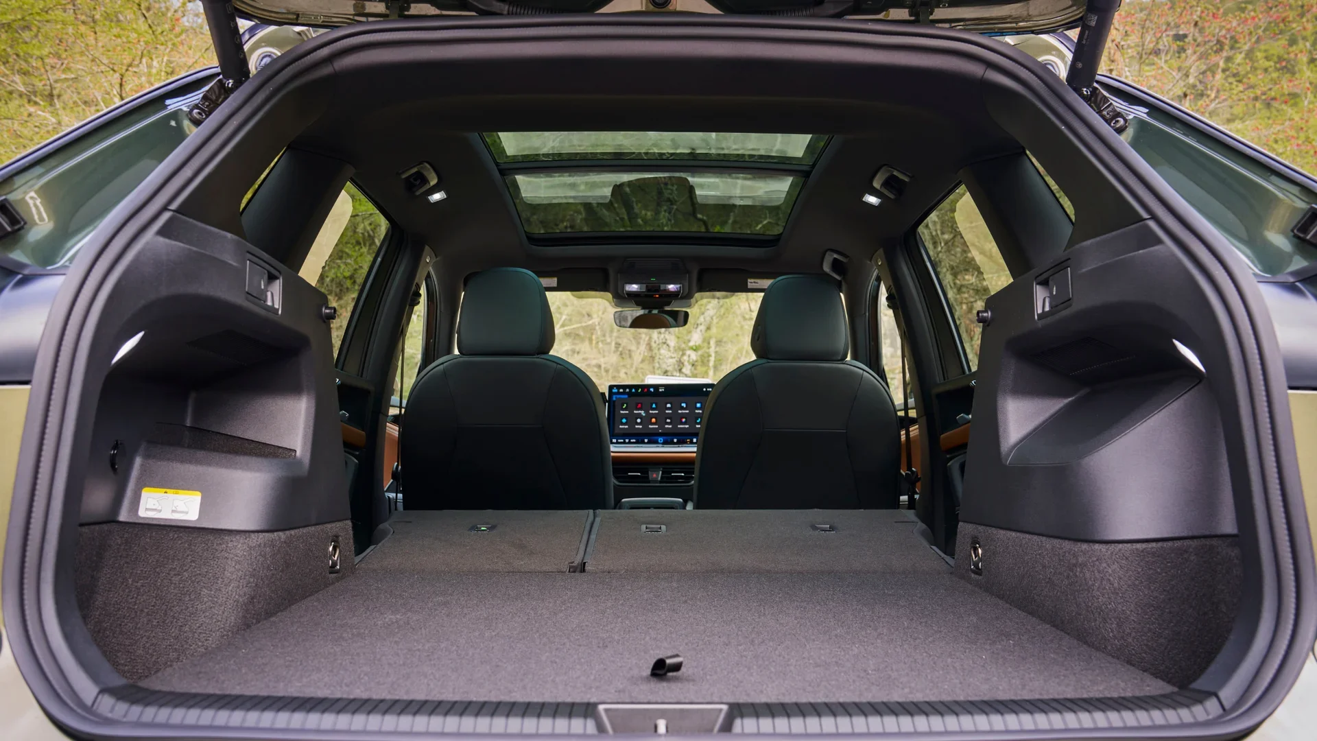 Rear cargo space of the 2026 Volkswagen Tiguan SEL R-Line Turbo with seats folded down, showcasing storage capacity.